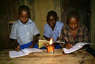https://energypedia.info/wiki/File:Children_reading_with_kerosene_lamp.jpg